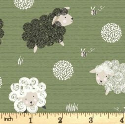 Sheep pattern on fabric with a ruler for scale